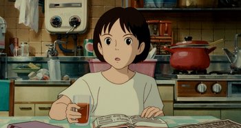 Movie still from “Whisper of the Heart” (1995), directed by Yoshifumi Kondô – A woman sitting at a table holding a glass of beer; Medium shot, High angle