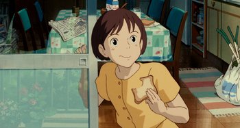 Movie still from “Whisper of the Heart” (1995), directed by Yoshifumi Kondô – A girl sitting in front of a table holding a piece of bread; Medium shot, High angle