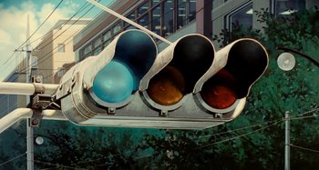 Movie still from “Whisper of the Heart” (1995), directed by Yoshifumi Kondô – A traffic light on a street; Wide shot, Low angle