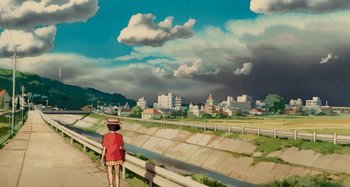 Movie still from “Whisper of the Heart” (1995), directed by Yoshifumi Kondô – A person standing on a sidewalk near a river; Extreme Wide shot, Low angle