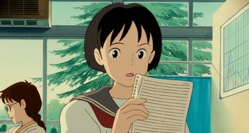 Movie still from “Whisper of the Heart” (1995), directed by Yoshifumi Kondô – A woman holding a piece of paper in front of a window; Close Up shot, Low angle