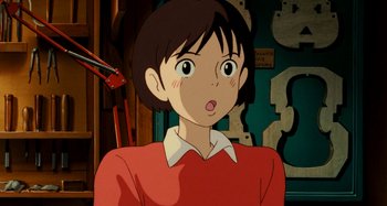 Movie still from “Whisper of the Heart” (1995), directed by Yoshifumi Kondô – A person with short brown hair; Close Up shot, High angle