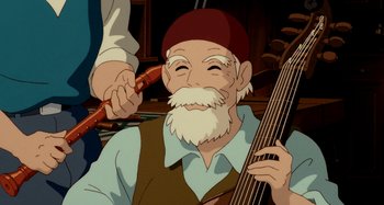 Movie still from “Whisper of the Heart” (1995), directed by Yoshifumi Kondô – An old man with a beard is holding an instrument; Close Up shot, Over the shoulder angle