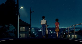 Movie still from “Whisper of the Heart” (1995), directed by Yoshifumi Kondô – Two people standing on a hill at night with a bicycle; Wide shot, Low angle