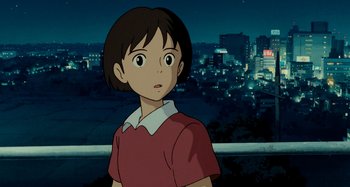 Movie still from “Whisper of the Heart” (1995), directed by Yoshifumi Kondô – A young girl standing in front of a city skyline at night; Close Up shot, Low angle