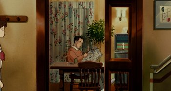 Movie still from “Whisper of the Heart” (1995), directed by Yoshifumi Kondô – A man sitting at a dining room table reading a newspaper; Wide shot, High angle