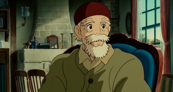 Movie still from “Whisper of the Heart” (1995), directed by Yoshifumi Kondô – An old man with a white beard wearing a red hat; Close Up shot, High angle