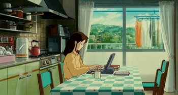 Movie still from “Whisper of the Heart” (1995), directed by Yoshifumi Kondô – A woman sitting at a table using a computer; Wide shot, High angle