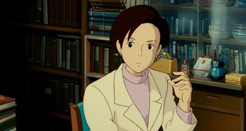 Movie still from “Whisper of the Heart” (1995), directed by Yoshifumi Kondô – A person sitting in a chair holding a book; Medium shot, High angle