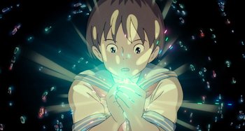 Movie still from “Whisper of the Heart” (1995), directed by Yoshifumi Kondô – A young boy is holding his hands together in front of his face; Close Up shot, High angle