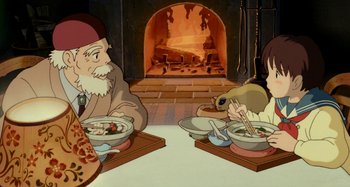 Movie still from “Whisper of the Heart” (1995), directed by Yoshifumi Kondô – A couple of people sitting at a table with food; Medium shot, High angle