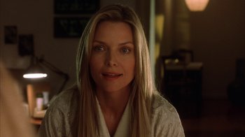 Movie still from “White Oleander” (2002), directed by Peter Kosminsky – A person with long blonde hair; Close Up shot, Over the shoulder angle