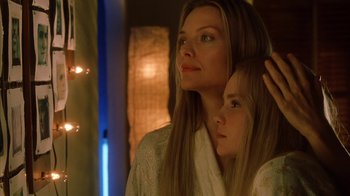 Movie still from “White Oleander” (2002), directed by Peter Kosminsky – A woman and a young girl are looking at each other; Close Up shot, Low angle