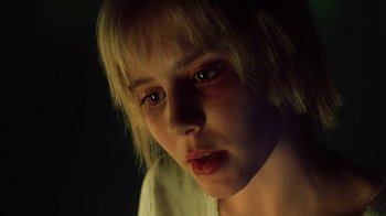 Movie still from “White Oleander” (2002), directed by Peter Kosminsky – A person with short blonde hair; Close Up shot, Low angle