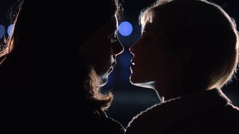 Movie still from “White Oleander” (2002), directed by Peter Kosminsky – Two people face to face in the dark with a blue moon in the background; Close Up shot, Low angle
