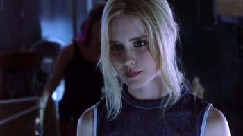 Movie still from “White Oleander” (2002), directed by Peter Kosminsky – A woman with blonde hair is looking at the camera; Close Up shot, Low angle