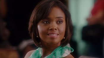 Movie still from “Why Did I Get Married Too?” (2010), directed by Tyler Perry – A person wearing a green scarf; Close Up shot, Over the shoulder angle