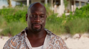 Movie still from “Why Did I Get Married Too?” (2010), directed by Tyler Perry – A person wearing a shirt; Close Up shot, Over the shoulder angle