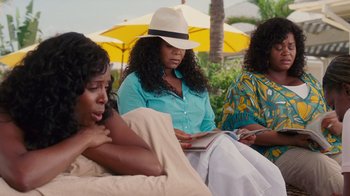 Movie still from “Why Did I Get Married Too?” (2010), directed by Tyler Perry – A group of women sitting next to each other on a bench; Medium shot, Over the shoulder angle