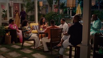 Movie still from “Why Did I Get Married Too?” (2010), directed by Tyler Perry – A group of people sitting around a table; Wide shot, High angle