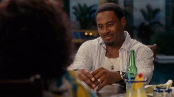 Movie still from “Why Did I Get Married Too?” (2010), directed by Tyler Perry – A man sitting at a table in front of a woman; Close Up shot, Over the shoulder angle