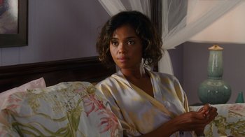 Movie still from “Why Did I Get Married Too?” (2010), directed by Tyler Perry – A beautiful young woman in a robe holding a pillow; Close Up shot, Over the shoulder angle