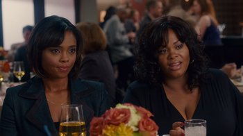 Movie still from “Why Did I Get Married Too?” (2010), directed by Tyler Perry – Two women sitting at a table with a glass of wine; Medium shot, Over the shoulder angle