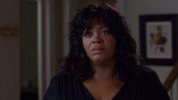 Movie still from “Why Did I Get Married Too?” (2010), directed by Tyler Perry – A woman in a black shirt is looking at the camera; Close Up shot, Over the shoulder angle