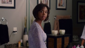 Movie still from “Why Did I Get Married Too?” (2010), directed by Tyler Perry – A woman standing next to a table with a cup of coffee; Medium shot, Over the shoulder angle