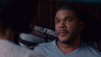 Movie still from “Why Did I Get Married Too?” (2010), directed by Tyler Perry – A person sitting in front of a window; Close Up shot, Over the shoulder angle