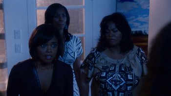 Movie still from “Why Did I Get Married Too?” (2010), directed by Tyler Perry – A group of women standing next to each other in a room; Medium shot, Over the shoulder angle