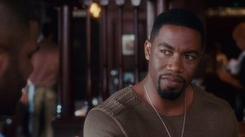 Movie still from “Why Did I Get Married Too?” (2010), directed by Tyler Perry – A person wearing a sweater; Close Up shot, Over the shoulder angle