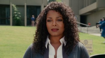 Movie still from “Why Did I Get Married Too?” (2010), directed by Tyler Perry – A person with curly hair; Close Up shot, Over the shoulder angle