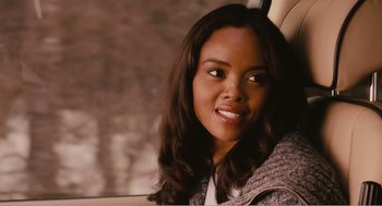 Movie still from “Why Did I Get Married?” (2007), directed by Tyler Perry – A woman sitting in the back seat of a car; Close Up shot, Over the shoulder angle