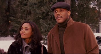 Movie still from “Why Did I Get Married?” (2007), directed by Tyler Perry – A man and a woman standing next to each other in front of trees; Medium shot, Low angle