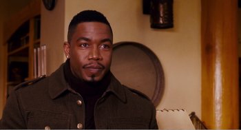 Movie still from “Why Did I Get Married?” (2007), directed by Tyler Perry – A man with a beard and a jacket on; Close Up shot, High angle