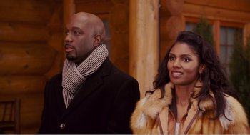 Movie still from “Why Did I Get Married?” (2007), directed by Tyler Perry – A man and a woman standing next to each other; Medium shot, Over the shoulder angle