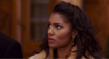 Movie still from “Why Did I Get Married?” (2007), directed by Tyler Perry – A person wearing a jacket; Close Up shot, Over the shoulder angle
