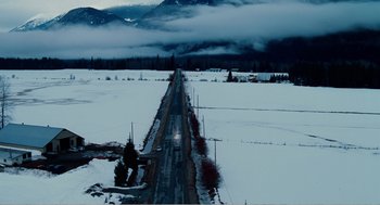 Movie still from “Why Did I Get Married?” (2007), directed by Tyler Perry – An aerial view of a road in the middle of a snow covered field; Extreme Wide shot, High angle