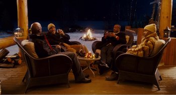 Movie still from “Why Did I Get Married?” (2007), directed by Tyler Perry – A group of people sitting around a fire pit; Wide shot, High angle