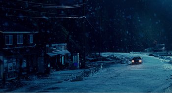 Movie still from “Why Did I Get Married?” (2007), directed by Tyler Perry – A car driving down a street in the snow; Extreme Wide shot, High angle