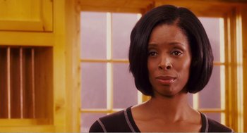 Movie still from “Why Did I Get Married?” (2007), directed by Tyler Perry – A person wearing a black shirt; Close Up shot, Low angle