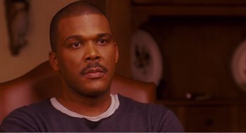 Movie still from “Why Did I Get Married?” (2007), directed by Tyler Perry – A person sitting in a chair; Close Up shot, High angle