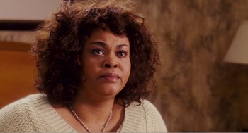 Movie still from “Why Did I Get Married?” (2007), directed by Tyler Perry – A person with curly hair; Close Up shot, Over the shoulder angle