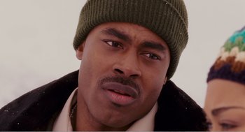Movie still from “Why Did I Get Married?” (2007), directed by Tyler Perry – A person wearing a hat and a jacket; Close Up shot, High angle