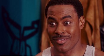 Movie still from “Why Did I Get Married?” (2007), directed by Tyler Perry – A person with a surprised look on his face; Close Up shot, Over the shoulder angle