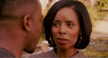 Movie still from “Why Did I Get Married?” (2007), directed by Tyler Perry – A man and a woman face to face in front of trees; Close Up shot, Over the shoulder angle