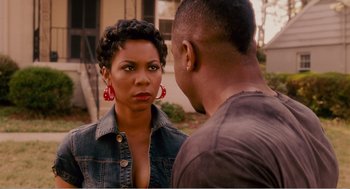 Movie still from “Why Did I Get Married?” (2007), directed by Tyler Perry – A man and a woman standing next to each other; Close Up shot, Over the shoulder angle