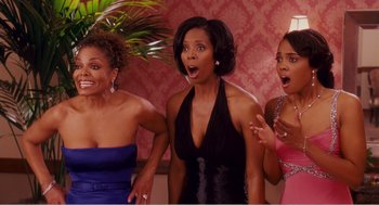 Movie still from “Why Did I Get Married?” (2007), directed by Tyler Perry – A group of three women standing next to each other; Medium shot, High angle