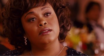Movie still from “Why Did I Get Married?” (2007), directed by Tyler Perry – A person wearing a necklace; Close Up shot, High angle